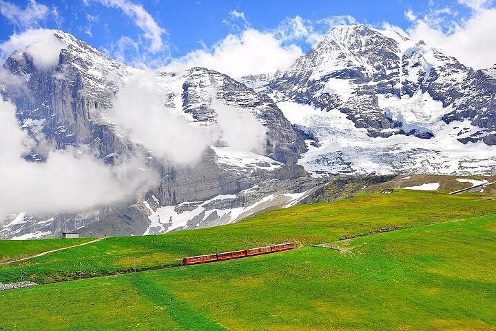 A serene view of the Swiss Alps covered in snow